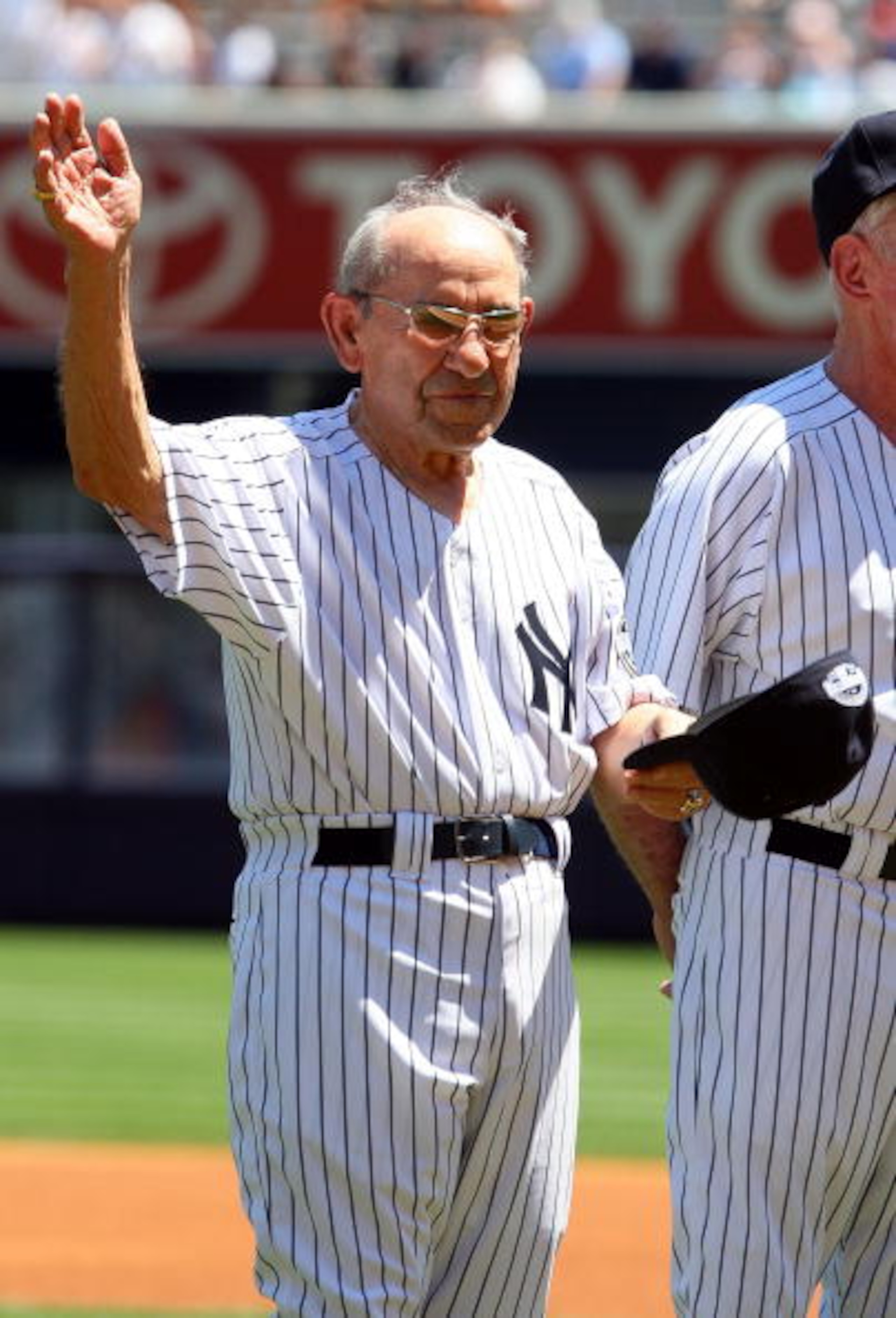 NEW YORK - JULY 19: New York Yankees Hall of Famer Yogi Berra waves to the crowd during the teams 63rd Old Timers Day before the game against the Detroit Tigers on July 19, 2009 at Yankee Stadium in the Bronx borough of New York City. (Photo by Jim McIs NEW YORK - JULY 19: New York Yankees Hall of Famer Yogi Berra waves to the crowd during the teams 63rd Old Timers Day before the game against the Detroit Tigers on July 19, 2009 at Yankee Stadium in the Bronx borough of New York City. (Photo by Jim McIs