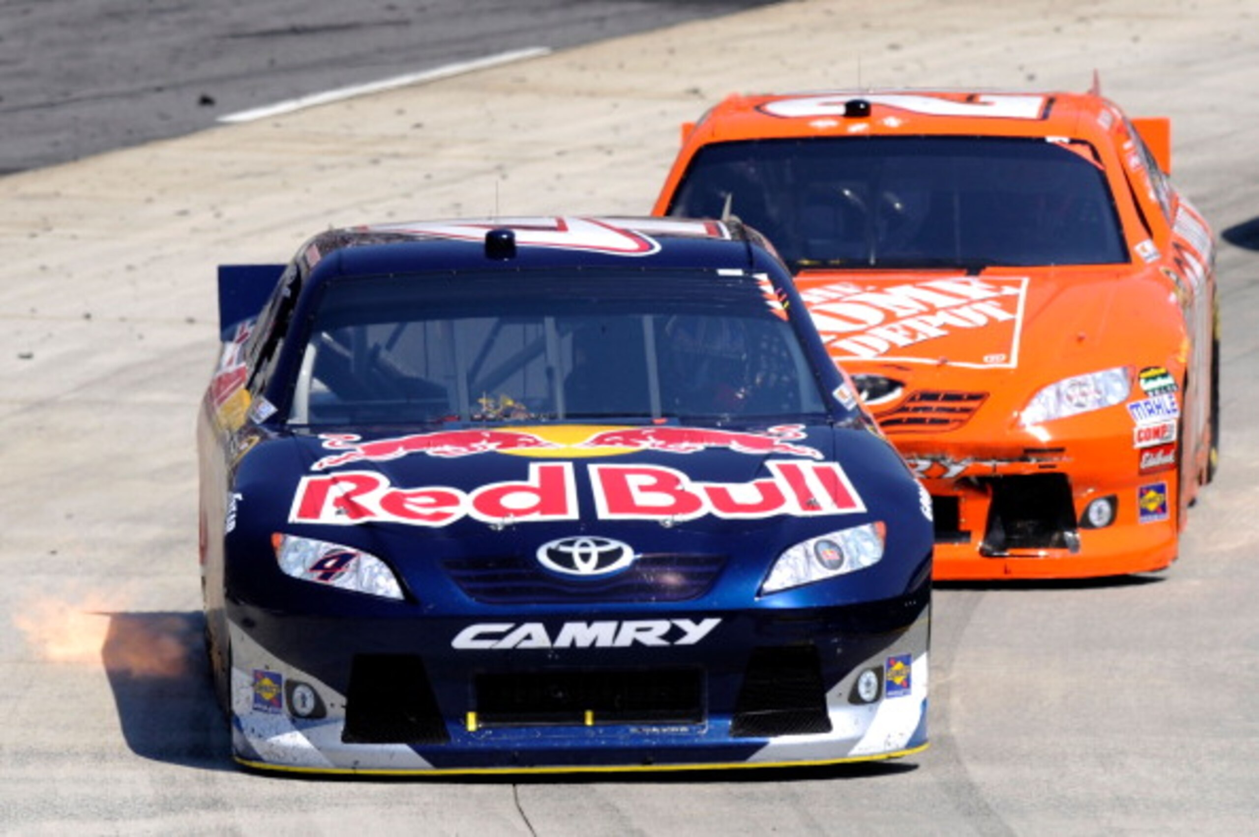 MARTINSVILLE, VA - APRIL 03: Kasey Kahne, driver of the #4 Red Bull Toyota, leads Joey Logano, driver of the #20 The Home Depot Toyota, during the NASCAR Sprint Cup Series Goody's Fast Relief 500 at Martinsville Speedway on April 3, 2011 in Martinsville, MARTINSVILLE, VA - APRIL 03: Kasey Kahne, driver of the #4 Red Bull Toyota, leads Joey Logano, driver of the #20 The Home Depot Toyota, during the NASCAR Sprint Cup Series Goody's Fast Relief 500 at Martinsville Speedway on April 3, 2011 in Martinsville,