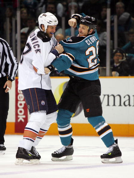 SAN JOSE, CA - JANUARY 02: Ryane Clowe #29 of the San Jose Sharks and Jason Strudwick #43 of the Edmonton Oilers get in a fight at HP Pavilion on January 2, 2010 in San Jose, California. (Photo by Ezra Shaw/Getty Images)