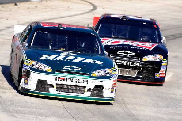 MARTINSVILLE, VA - APRIL 03:  Dale Earnhardt Jr., driver of the #88 Amp Energy/National Guard Chevrolet, leads Kevin Harvick, driver of the #29 Budweiser Chevrolet, during the NASCAR Sprint Cup Series Goody's Fast Relief 500 at Martinsville Speedway on Ap
