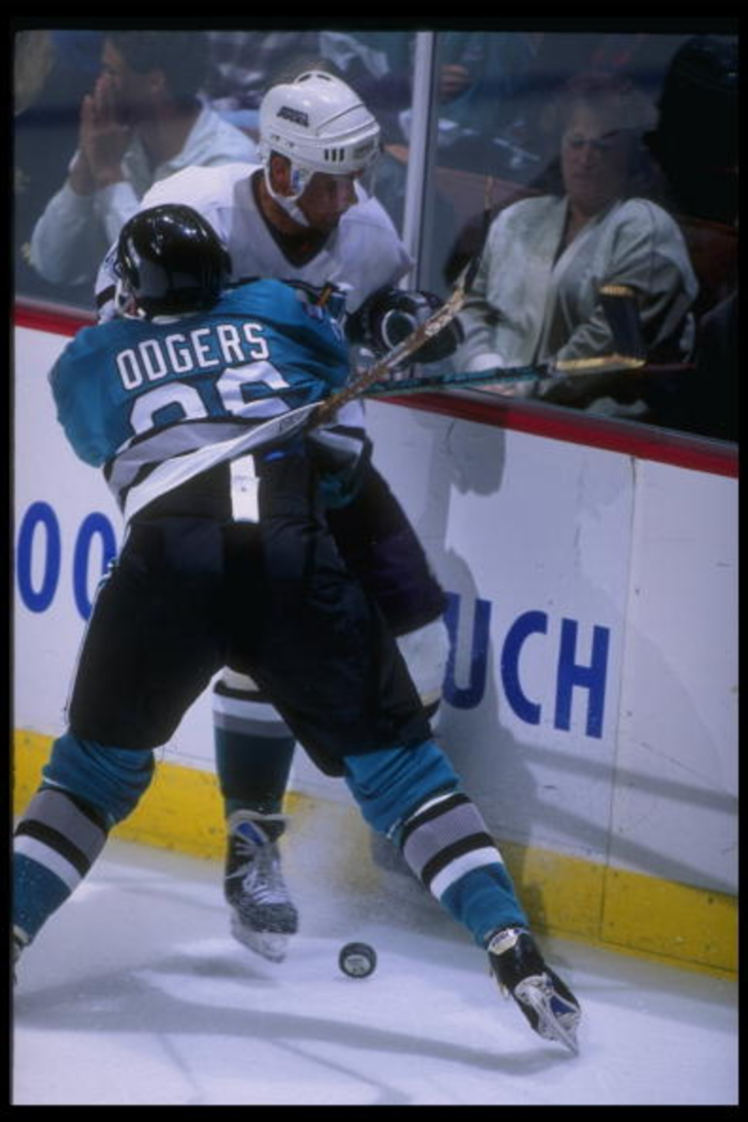 17 Apr 1995: Leftwinger Jeff Odgers of the San Jose Sharks and leftwinger Garry Valk of the Anaheim Mighty Ducks tangle up during a game at Arrowhead Pond in Anaheim, California. The Ducks won the game, 3-0.