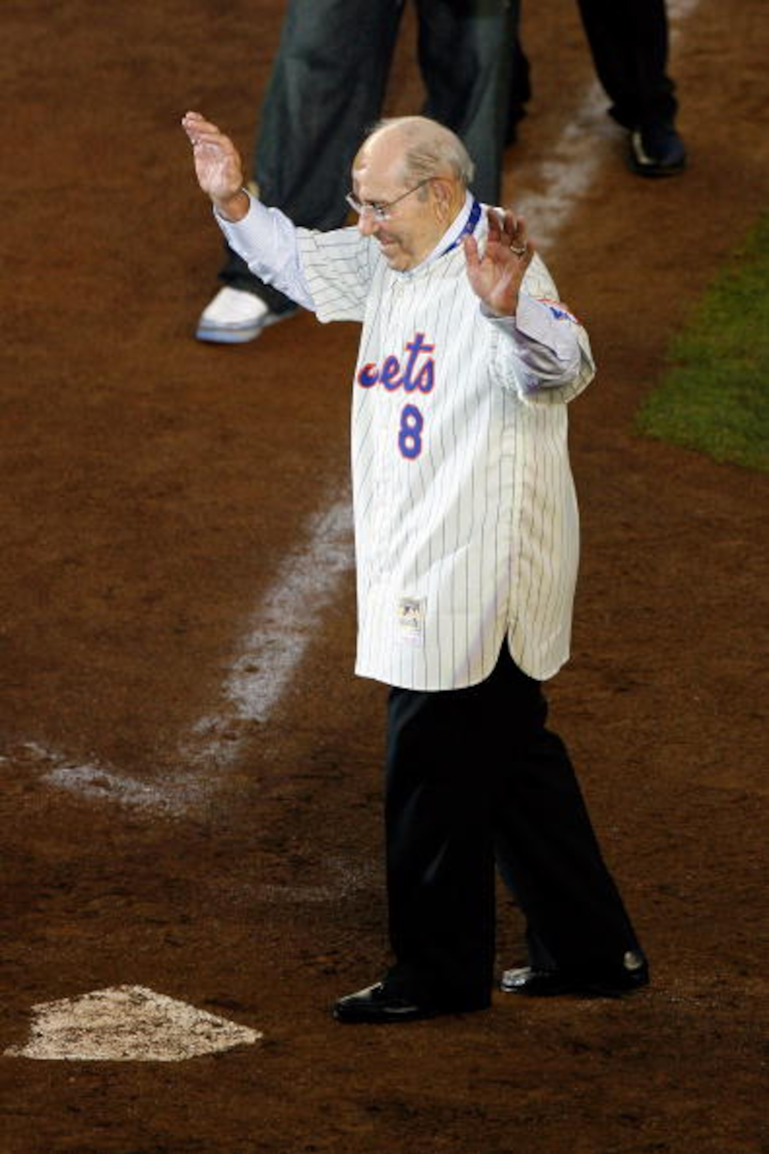 NEW YORK - SEPTEMBER 28: Former Mets manager Yogi Berra greets fans from the field in a post game ceremony after the last regular season baseball game ever played in Shea Stadium against the Florida Marlins on September 28, 2008 in the Flushing neighborh NEW YORK - SEPTEMBER 28: Former Mets manager Yogi Berra greets fans from the field in a post game ceremony after the last regular season baseball game ever played in Shea Stadium against the Florida Marlins on September 28, 2008 in the Flushing neighborh