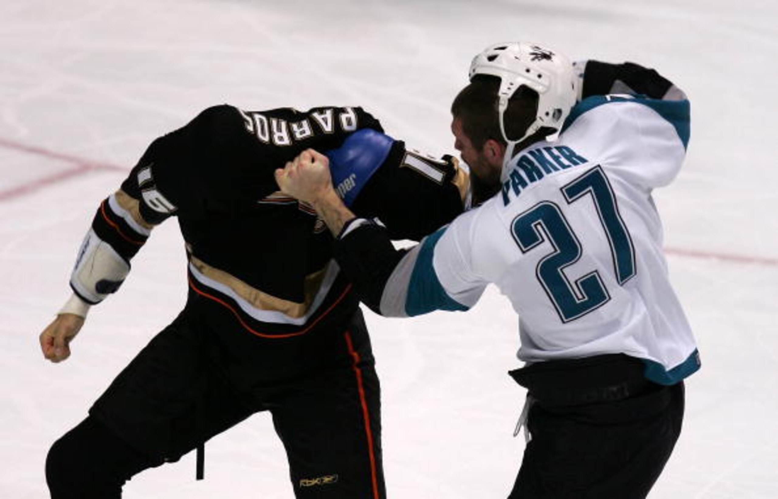 ANAHEIM, CA - NOVEMBER 20:  George Parros #16 of the Anaheim Ducks fights with Scott Parker #27 of the San Jose Sharks during the second period of a NHL game at the Honda Center November 21, 2006 in Anaheim, California.  (Photo by Robert Laberge/Getty Ima