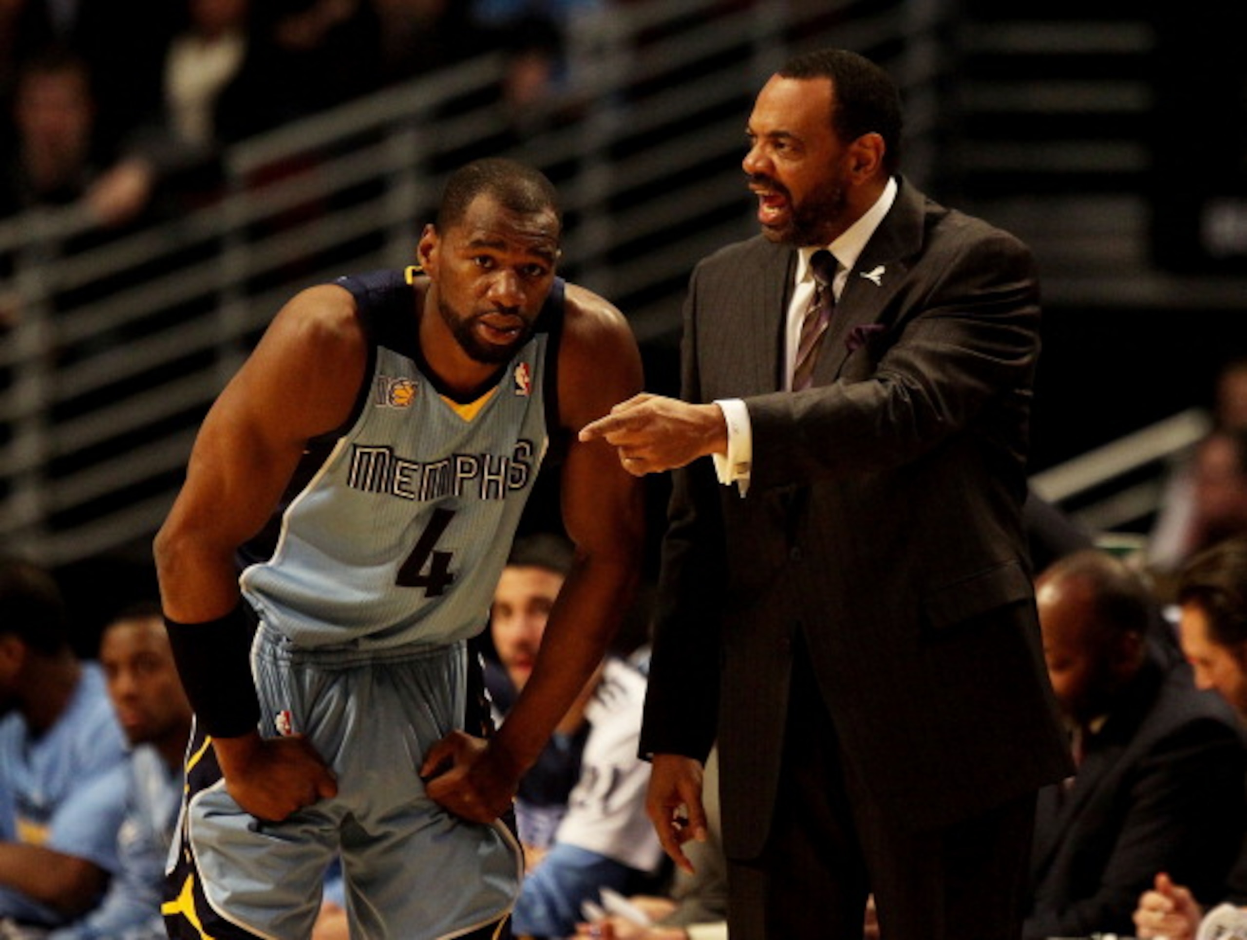 CHICAGO, IL - MARCH 25: Head coach Lionel Hollins  of the Memphis Grizzlies gives instructions to Sam Young #4 during a game against the Chicago Bulls at the United Center on March 25, 2011 in Chicago, Illinois. The Bulls defeated the Grizzlies 99-96. NOT