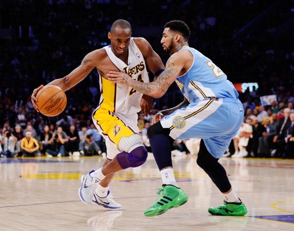 LOS ANGELES, CA - APRIL 03:  Kobe Bryant #24 of the Los Angeles Lakers drives against Wilson Chandler #21 of the Denver Nuggets during the game at Staples Center on April 3, 2011 in Los Angeles, California. NOTE TO USER: User expressly acknowledges and ag