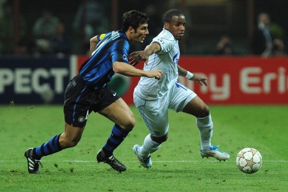 MILAN, ITALY - APRIL 05:  Javier Zanetti of FC Internazionale Milano  battles for the ball with Jefferson Farfan of Schalke 04 during the UEFA Champions League Quarter Final match between FC Internazionale Milano and Schalke 04 at San Siro Stadium on Apri