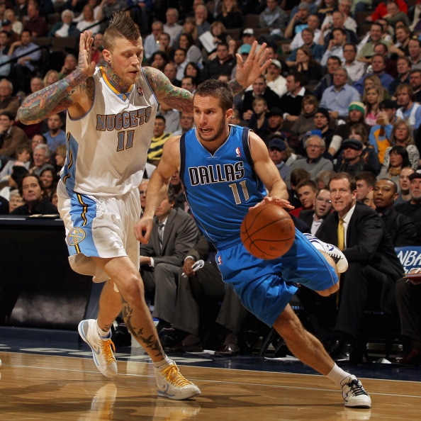 DENVER, CO - FEBRUARY 10:  Jose Barea #11 of the Dallas Mavericks drives the ball against Chris Andersen #11 of the Denver Nuggets during NBA action at the Pepsi Center on February 10, 2011 in Denver, Colorado. NOTE TO USER: User expressly acknowledges an