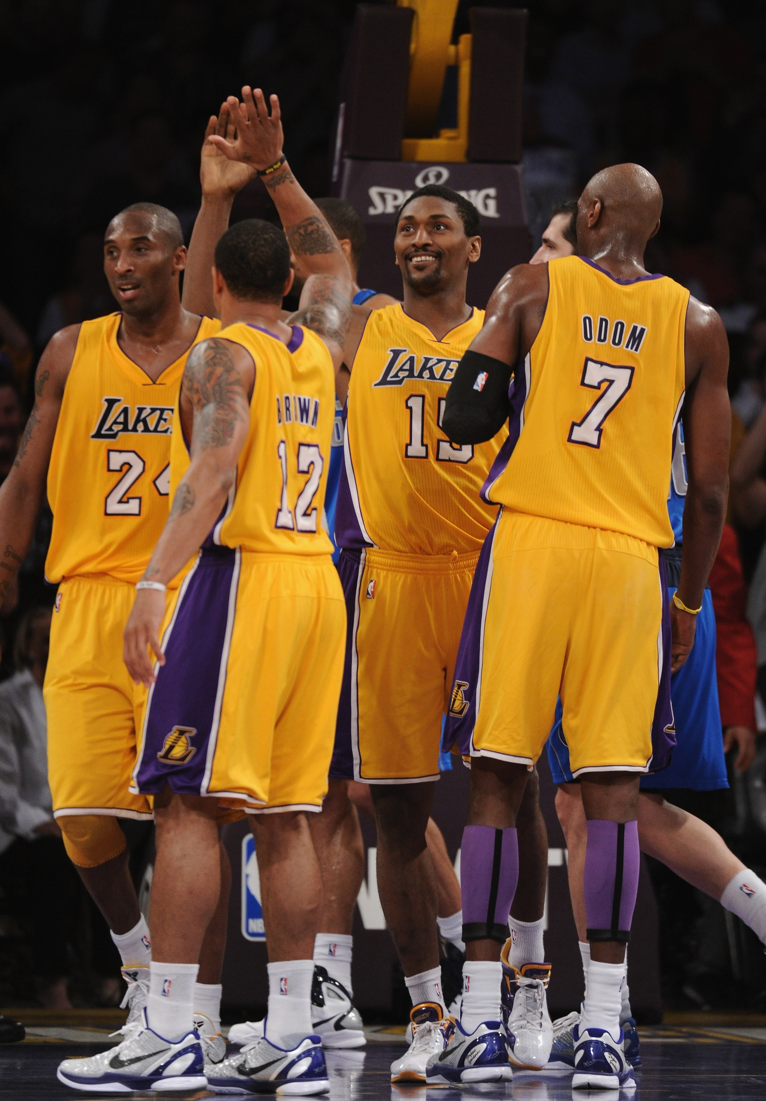 LOS ANGELES, CA - MARCH 31:  Ron Artest #15 of the Los Angeles Lakers celebrates his basket and a foul with Shannon Brown #12, Kobe Bryant #24 and Lamar Odom #7 during a 110-82 win over the Dallas Mavericks at Staples Center on March 31, 2011 in Los Angel