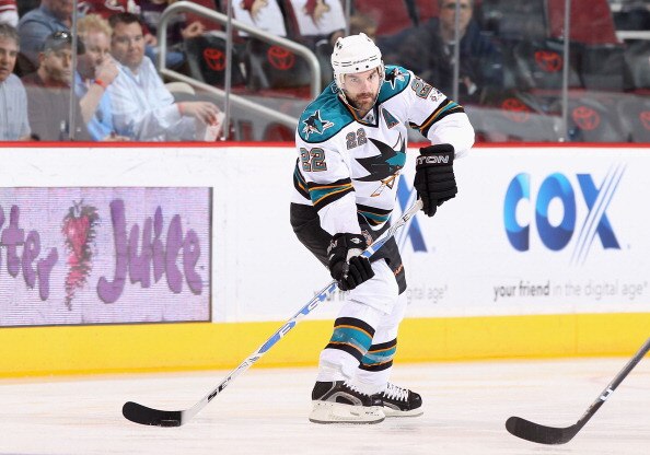 GLENDALE, AZ - MARCH 26:  Dan Boyle #22 of the San Jose Sharks skates with the puck during the NHL game against the Phoenix Coyotes at Jobing.com Arena on March 26, 2011 in Glendale, Arizona. The Sharks defeated the Coyotes 4-1.  (Photo by Christian Peter