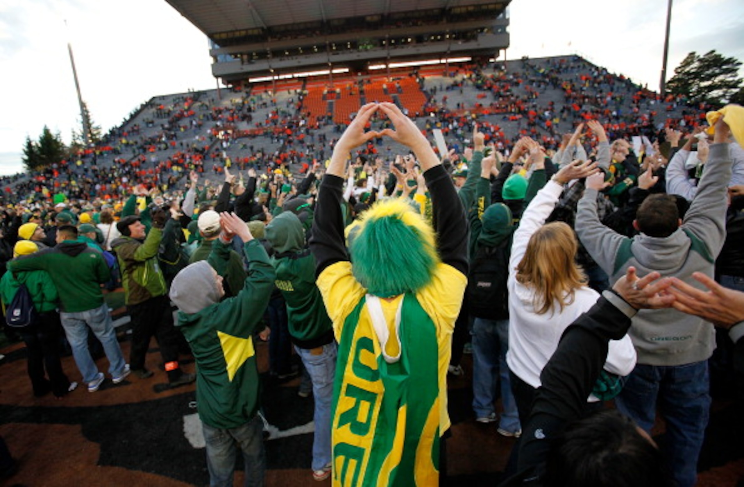 CORVALLIS, OR - DECEMBER 04:  Fans of the Oregon Ducks rush onto te field after te 37-20 victory over the Oregon State Beavers during the 114th Civil War on December 4, 2010 at the Reser Stadium in Corvallis, Oregon.  (Photo by Jonathan Ferrey/Getty Image