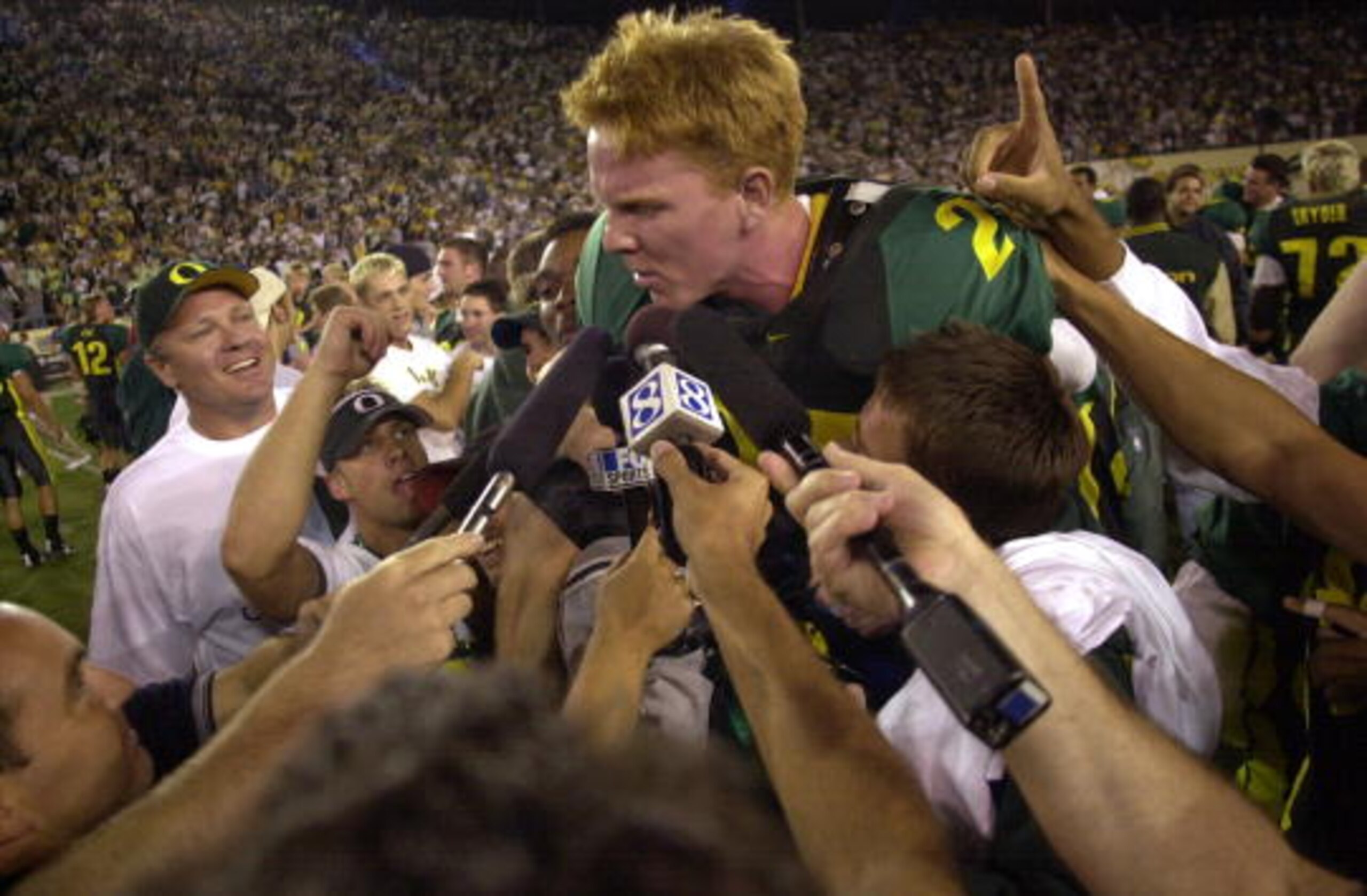 22 SEP 2001:  Place kicker Jared Siegel of the Oregon Ducks is hoisted up by teammates after kicking the winning field goal with 16 seconds left in the game to defeat the USC Trojans 24-22 at Autzen Stadium in Eugene, Oregon. DIGITAL IMAGE. Mandatory Cred