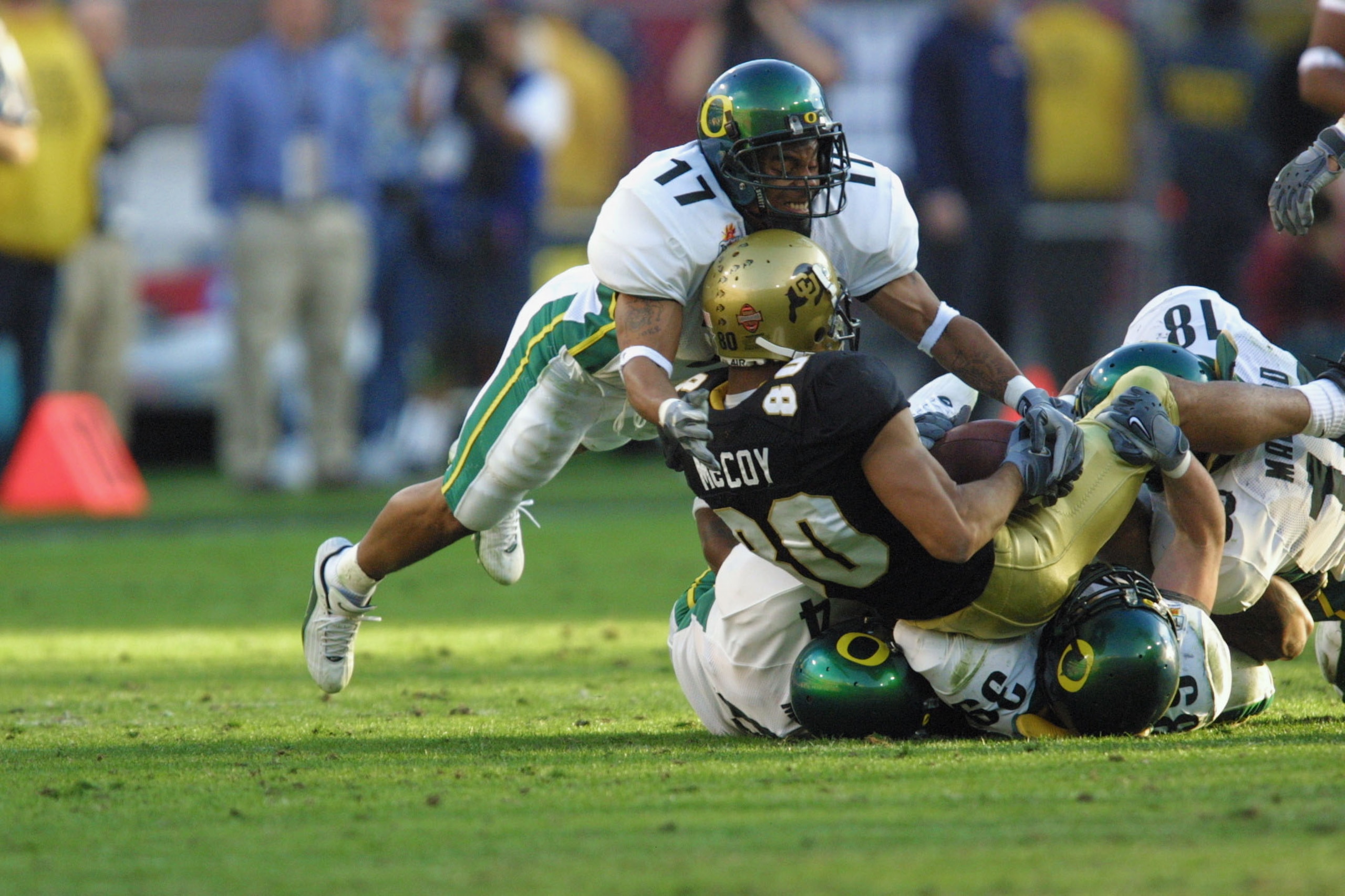 01 Jan 2002 :Rashad Bauman #17 of Oregon goes airborne over derek McCoy #80 of Colorado during the game at the  Fiesta Bowl at Sun Devil Stadium in Tempe, Arizona. The Oregon Ducks won 38-16. DIGITAL IMAGE. Mandatory Credit: Jeff Gross/Getty Images