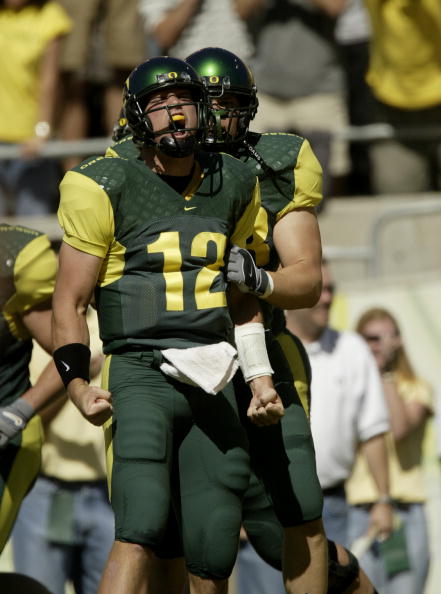 EUGENE, OR - SEPTEMBER 20:  Quarterback Jason Fife #12 of the University of Oregon Ducks celebrates after scoring a touchdown against the University of Michigan Wolverines on September 20, 2003 at Autzen Stadium in Eugene, Oregon. Oregon defeated Michigan