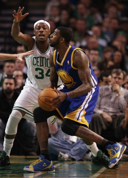 BOSTON, MA - MARCH 04:  Dorell Wright #1 of the Golden State Warriors tries to get around Paul Pierce #34 of the Boston Celtics on March 4, 2011 at the TD Garden in Boston, Massachusetts.  NOTE TO USER: User expressly acknowledges and agrees that, by down