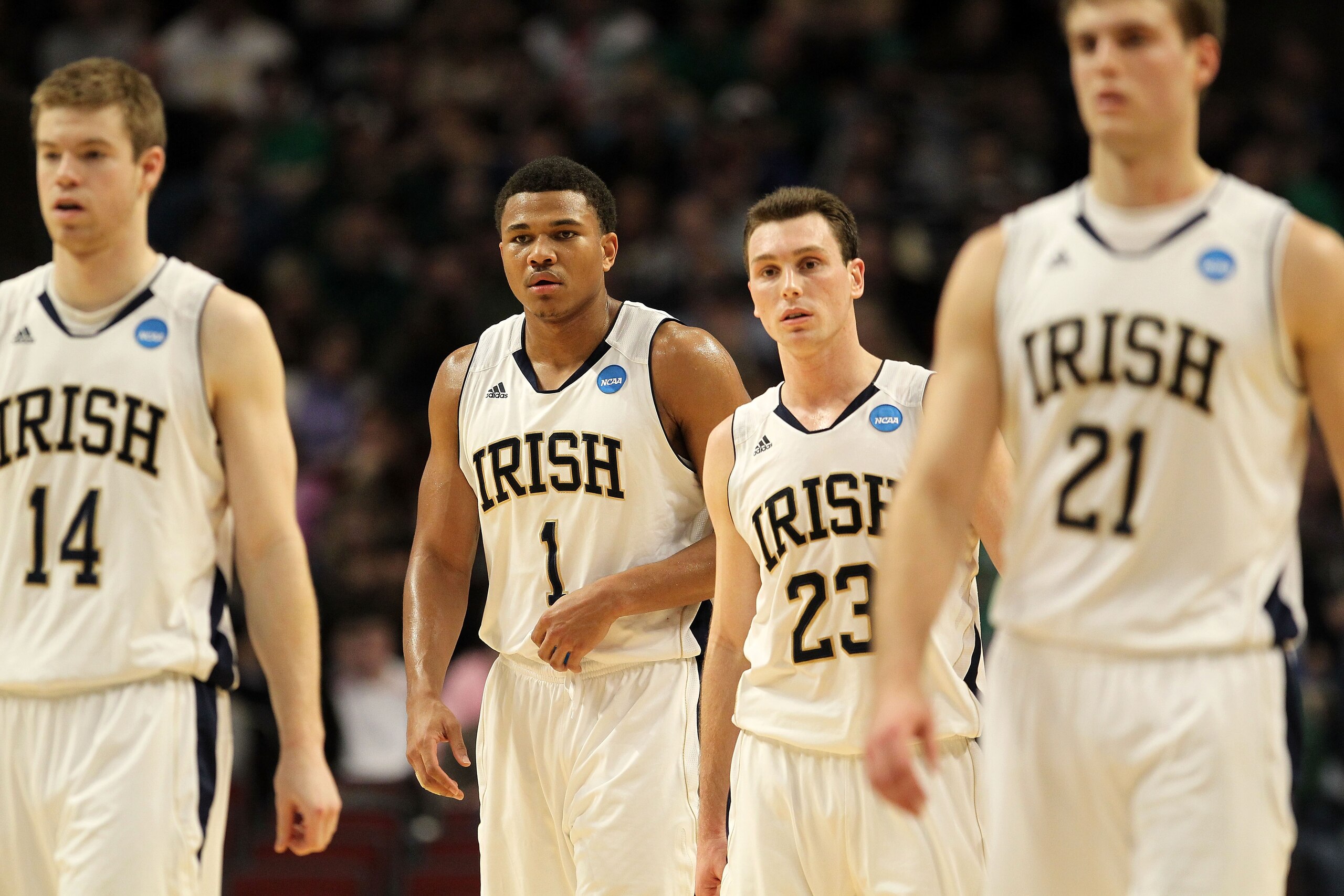 CHICAGO, IL - MARCH 20:  Scott Martin #14, Tyrone Nash #1, Ben Hansbrough #23 and Tim Abromaitis #21 of the Notre Dame Fighting Irish look on in the first half of the game against the Florida State Seminoles during the third round of the 2011 NCAA men's b