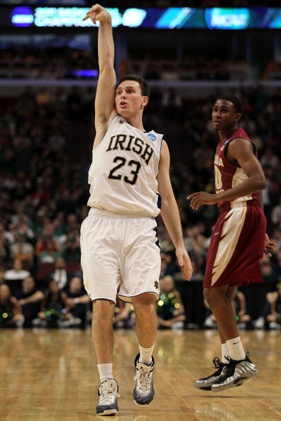 CHICAGO, IL - MARCH 20:  Ben Hansbrough #23 of the Notre Dame Fighting Irish follows through on a shot as Ian Miller #30 of the Florida State Seminoles looks on in the first half during the third round of the 2011 NCAA men's basketball tournament at the U
