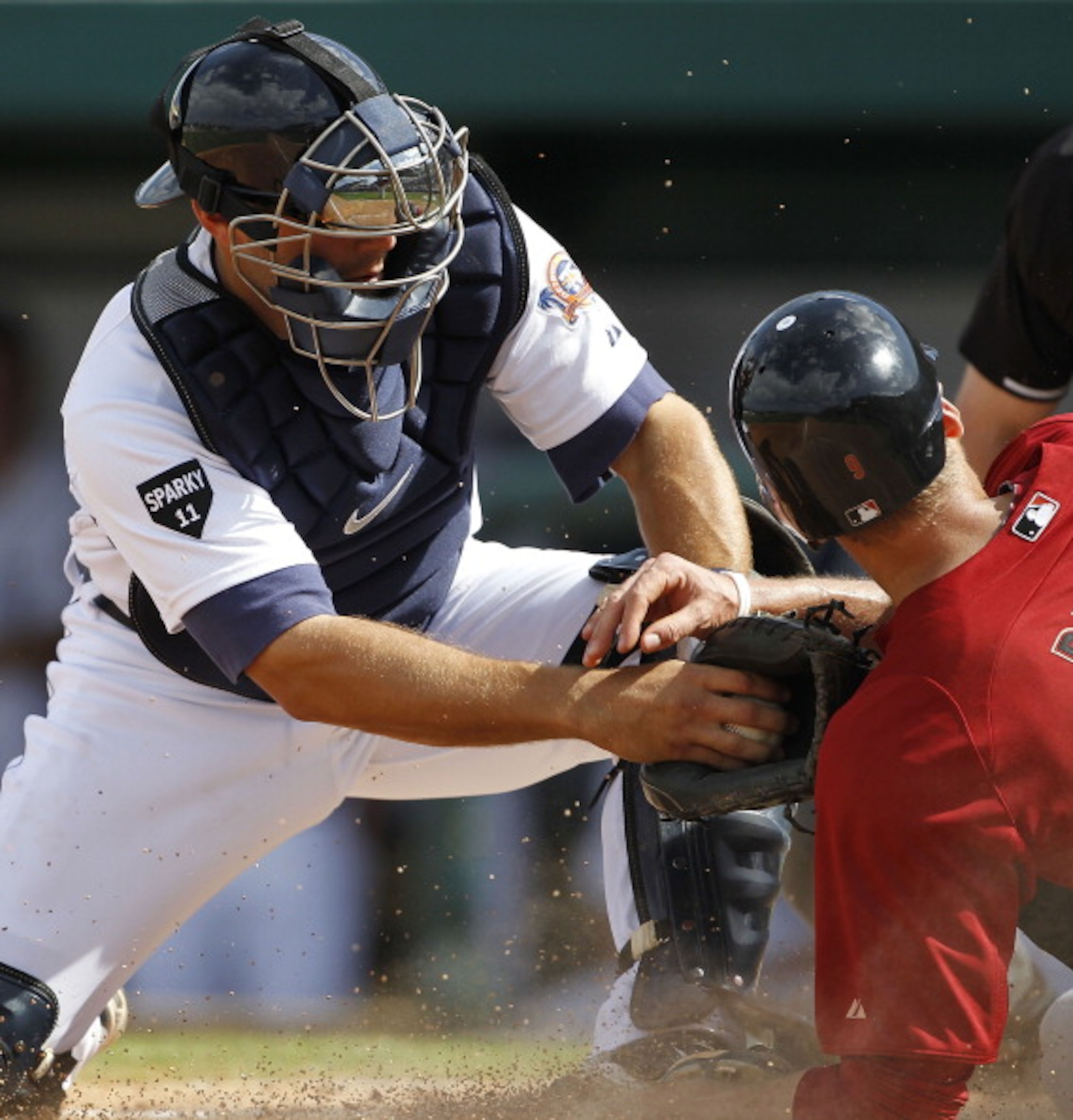 LAKELAND, FL - MARCH 02: Alex Avila #13 of the Detroit Tigers tags out Hunter Pence #9 of the Houston Astros during the game at Joker Marchant Stadium on March 2, 2011 in Lakeland, Florida. The Astros defeated the Tigers 6-3. (Photo by Leon Halip/Getty I LAKELAND, FL - MARCH 02: Alex Avila #13 of the Detroit Tigers tags out Hunter Pence #9 of the Houston Astros during the game at Joker Marchant Stadium on March 2, 2011 in Lakeland, Florida. The Astros defeated the Tigers 6-3. (Photo by Leon Halip/Getty I