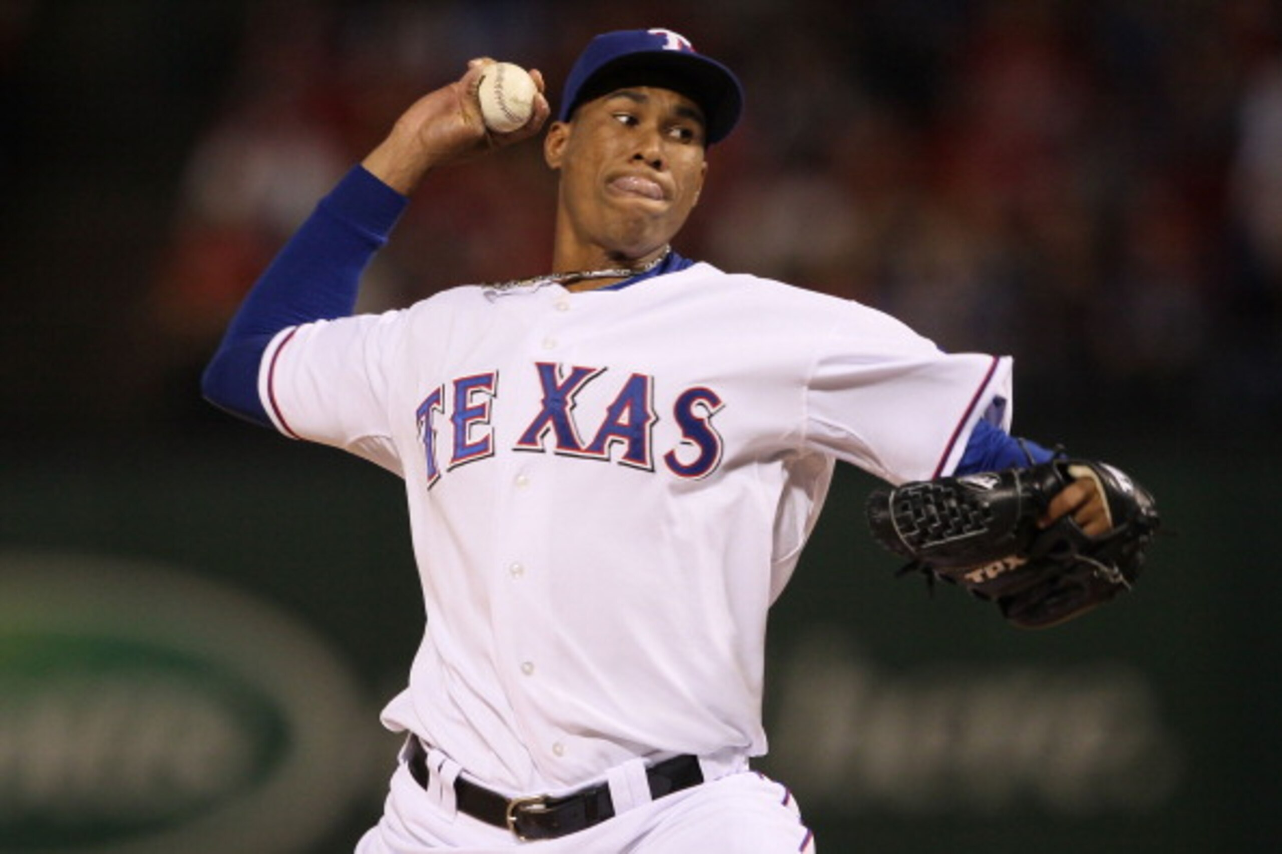 ARLINGTON, TX - OCTOBER 31: Alexi Ogando #64 of the Texas Rangers pitches against the San Francisco Giants in Game Four of the 2010 MLB World Series at Rangers Ballpark in Arlington on October 31, 2010 in Arlington, Texas. (Photo by Elsa/Getty Images) ARLINGTON, TX - OCTOBER 31: Alexi Ogando #64 of the Texas Rangers pitches against the San Francisco Giants in Game Four of the 2010 MLB World Series at Rangers Ballpark in Arlington on October 31, 2010 in Arlington, Texas. (Photo by Elsa/Getty Images)
