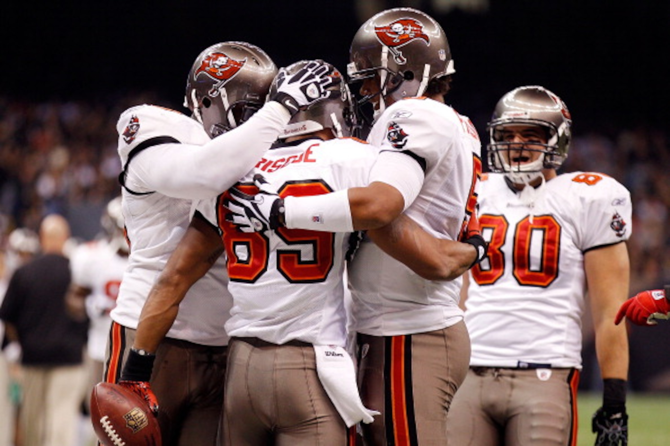 NEW ORLEANS, LA - JANUARY 02: Quarterback Josh Freeman #5 celebrates after throwing a touchdown with Dezmon Briscoe #89 of the Tampa Bay Buccaneers during the game against the New Orleans Saints at the Louisiana Superdome on January 2, 2011 in New Orlea NEW ORLEANS, LA - JANUARY 02: Quarterback Josh Freeman #5 celebrates after throwing a touchdown with Dezmon Briscoe #89 of the Tampa Bay Buccaneers during the game against the New Orleans Saints at the Louisiana Superdome on January 2, 2011 in New Orlea