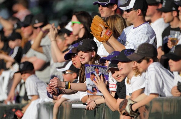 DENVER, CO - APRIL 02:  Fans look to get autographs from players as the Colorado Rockies host the Arizona Diamondbacks at Coors Field on April 2, 2011 in Denver, Colorado.  (Photo by Doug Pensinger/Getty Images)