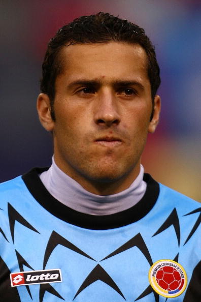 EAST RUTHERFORD, NJ - AUGUST 12: David Ospina #12 of Columbia listens to the national anthem prior to the start of the International Friendly against  Venezuela during their match at Giants Stadium on August 12, 2009 in East Rutherford, New Jersey.  (Phot