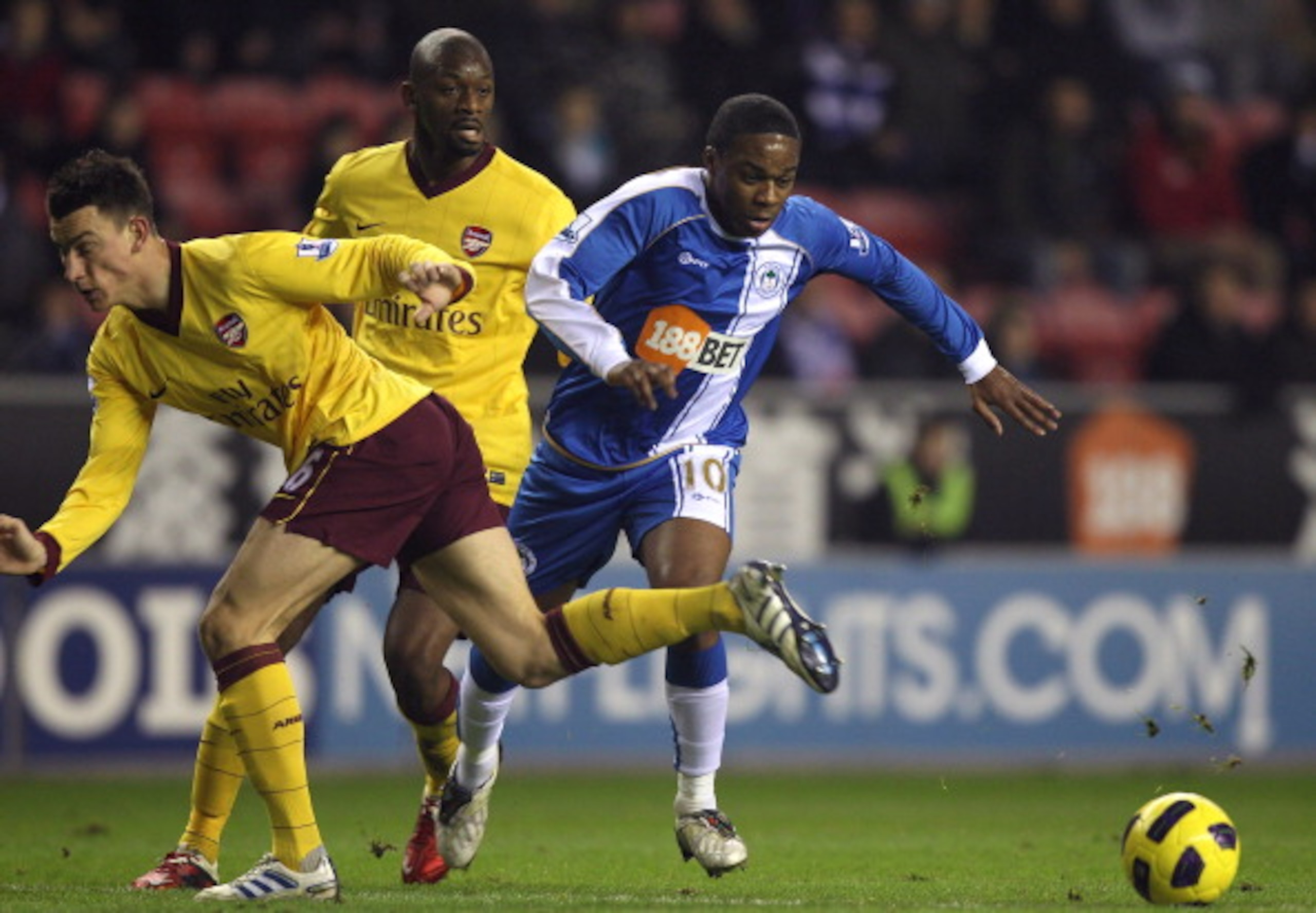 WIGAN, ENGLAND - DECEMBER 29:  Charles N'Zogbia (R) of Wigan Athletic is brought down by Laurent Koscielny of Arsenal to concede a penalty during the Barclays Premier League match between Wigan Athletic and Arsenal at DW Stadium on December 29, 2010 in Wi
