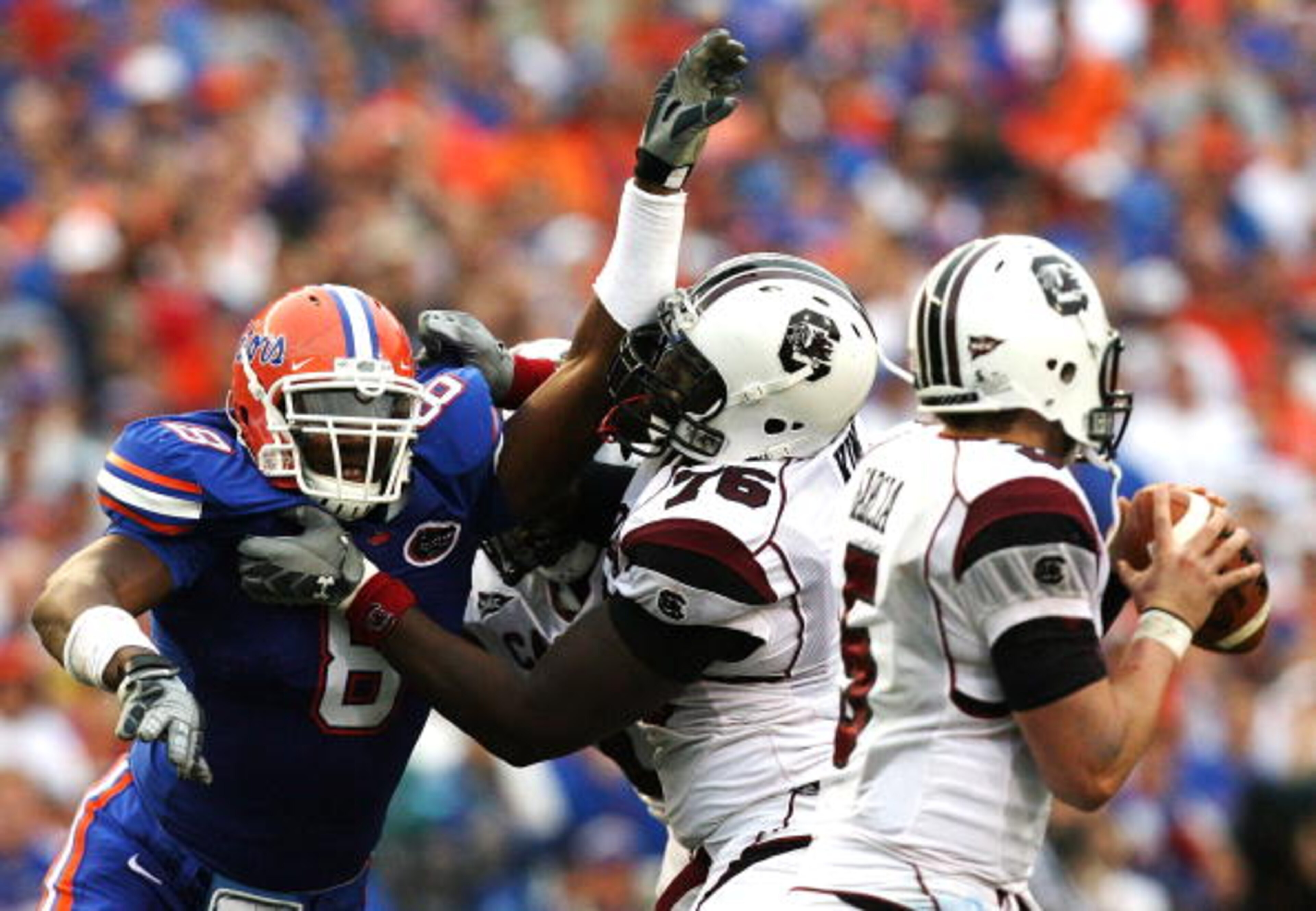 GAINESVILLE, FL - NOVEMBER 15: Offensive lineman Jarriel King #76 the South Carolina Gamecocks tries to protect his quarterback Stephen Garcia #5 from defensive end Carlos Dunlap #8 of the Florida Gators at Ben Hill Griffin Stadium on November 15, 2008 i GAINESVILLE, FL - NOVEMBER 15: Offensive lineman Jarriel King #76 the South Carolina Gamecocks tries to protect his quarterback Stephen Garcia #5 from defensive end Carlos Dunlap #8 of the Florida Gators at Ben Hill Griffin Stadium on November 15, 2008 i