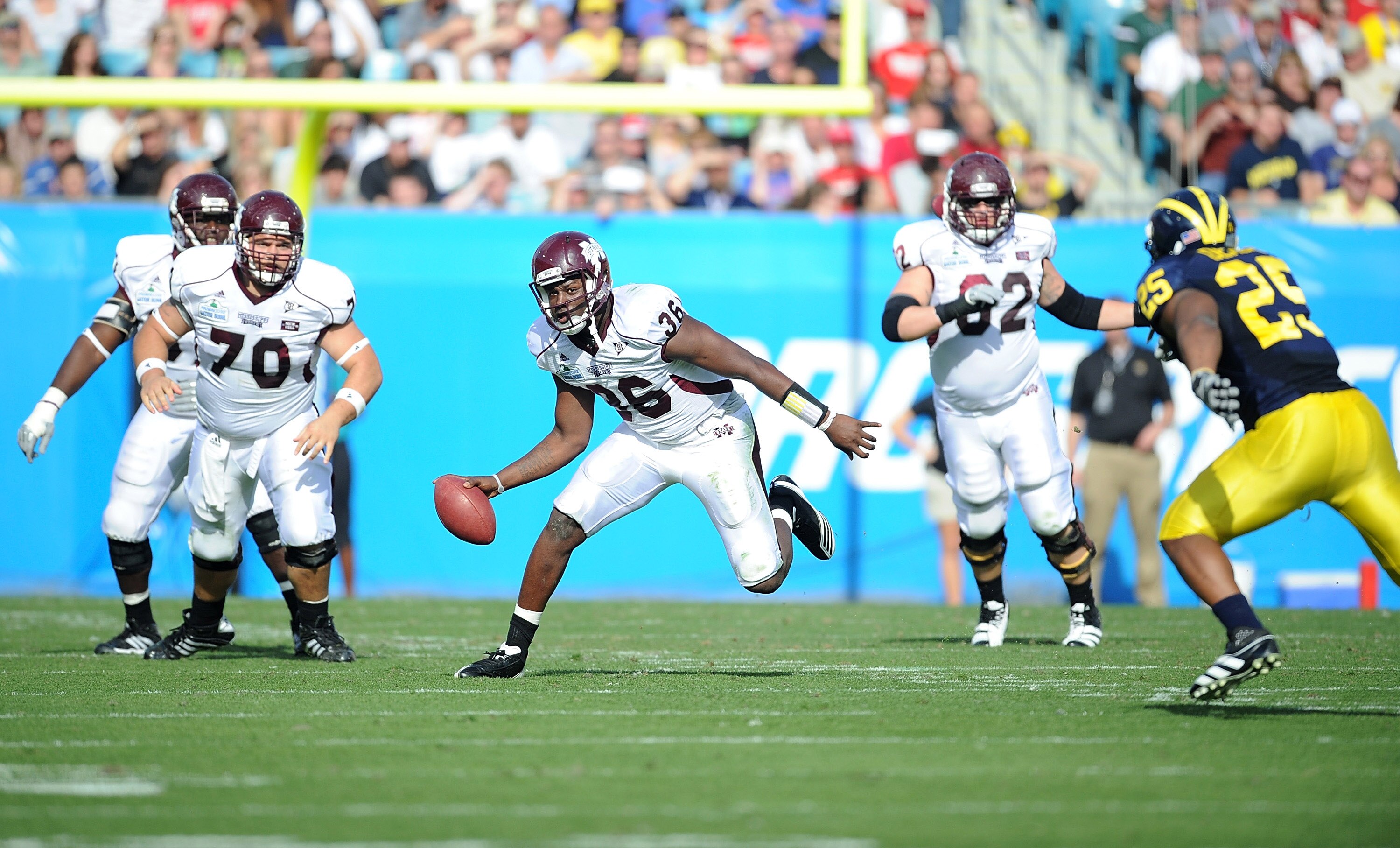 JACKSONVILLE, FL - JANUARY 01:  Quarterback Chris Relf# 36 of the Mississippi State Bulldogs rushes against the Michigan Wolverines during the Gator Bowl at EverBank Field on January 1, 2011 in Jacksonville, Florida  (Photo by Rick Dole/Getty Images)