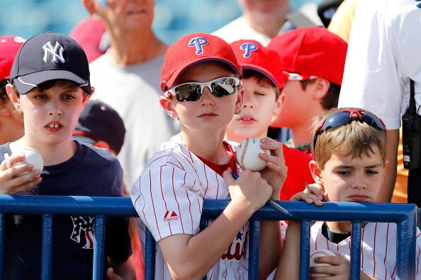 TAMPA, FL - FEBRUARY 26:  Fans of the New York Yankees and the Philadelphia Phillies look for autographs just before the start of a Grapefruit League Spring Training Game at George M. Steinbrenner Field on February 26, 2011 in Tampa, Florida.  (Photo by J