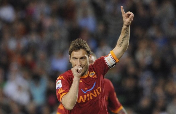 UDINE, ITALY - APRIL 09:  Francesco Totti of Roma celebrates after scoring  his opening penalty goal  during the Serie A match between Udinese Calcio and AS Roma at Stadio Friuli on April 9, 2011 in Udine, Italy.  (Photo by Dino Panato/Getty Images)