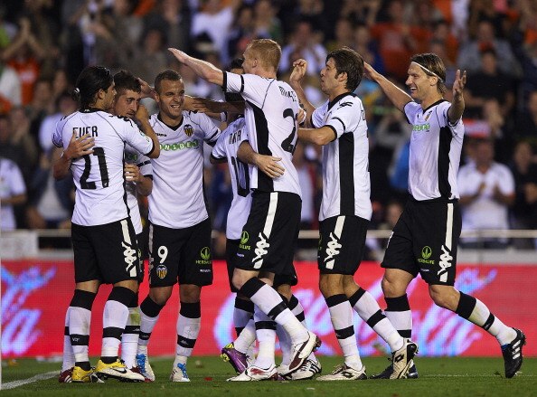 VALENCIA, VALENCIA - APRIL 10: Players  of Valencia celebrate the third goal during the La Liga match between Valencia and Villarreal at Estadio Mestalla on April 10, 2011 in Valencia, Spain.  (Photo by Manuel Queimadelos Alonso/Getty Images)