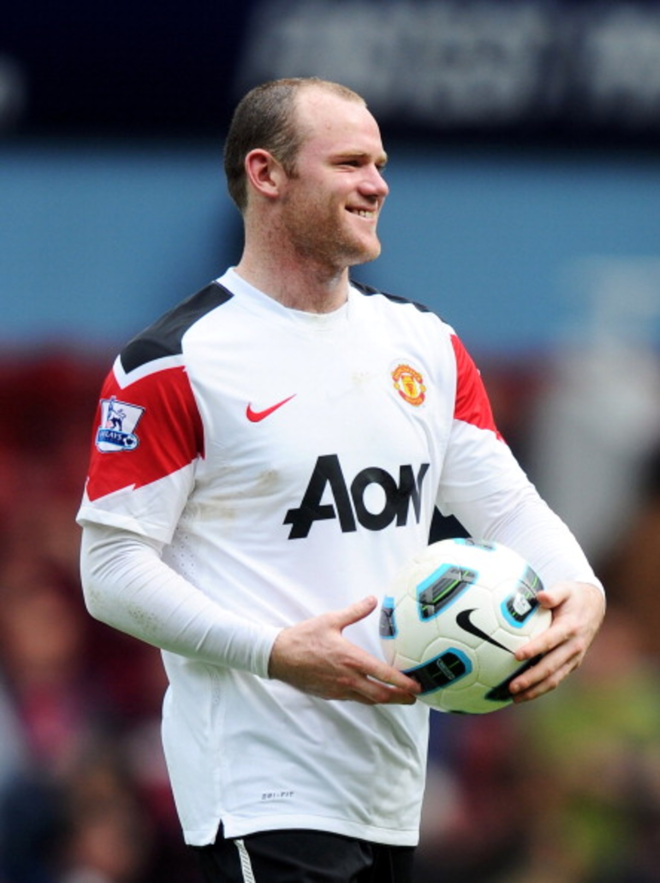 LONDON, ENGLAND - APRIL 02: Wayne Rooney of Manchester United leaves the field with the match ball after his hat trick during the Barclays Premier League match between West Ham United and Manchester United at the Boleyn Ground on April 2, 2011 in London, LONDON, ENGLAND - APRIL 02: Wayne Rooney of Manchester United leaves the field with the match ball after his hat trick during the Barclays Premier League match between West Ham United and Manchester United at the Boleyn Ground on April 2, 2011 in London,