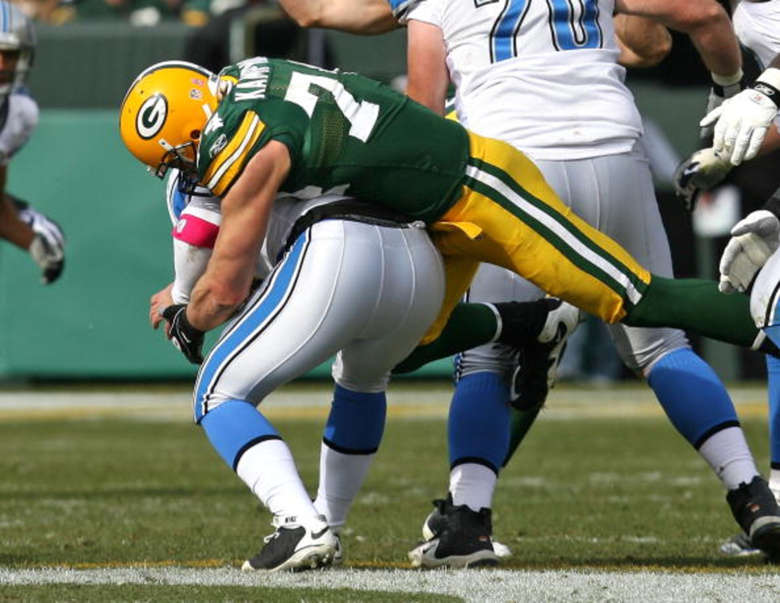 GREEN BAY, WI - OCTOBER 18: Aaron Kampman #74 of the Green Bay Packers sacks Duante Culpepper #11 of the Detroit Lions at Lambeau Field on October 18, 2009 in Green Bay, Wisconsin. The Packers defeated the Lions 26-0. (Photo by Jonathan Daniel/Getty Image GREEN BAY, WI - OCTOBER 18: Aaron Kampman #74 of the Green Bay Packers sacks Duante Culpepper #11 of the Detroit Lions at Lambeau Field on October 18, 2009 in Green Bay, Wisconsin. The Packers defeated the Lions 26-0. (Photo by Jonathan Daniel/Getty Image