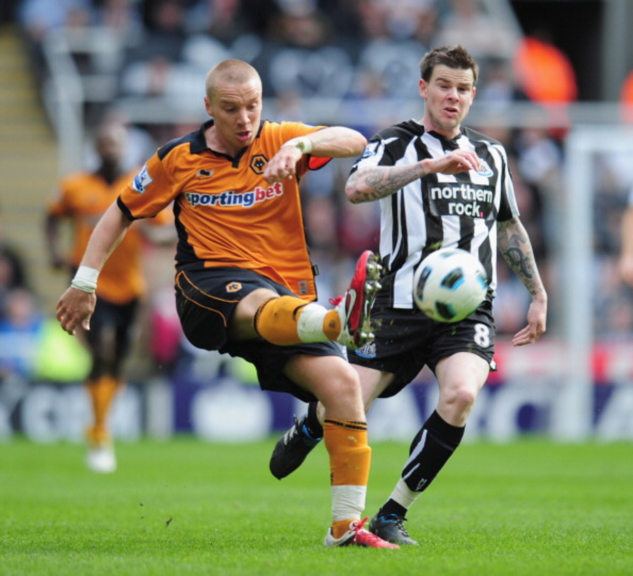 NEWCASTLE UPON TYNE, ENGLAND - APRIL 02: Jamie O'Hara of Wolverhampton Wanderers is challenged by Danny Guthrie of Newcastle United during the Barclays Premier League match between Newcastle United and Wolverhampton Wanderers at St James' Park on April 2 NEWCASTLE UPON TYNE, ENGLAND - APRIL 02: Jamie O'Hara of Wolverhampton Wanderers is challenged by Danny Guthrie of Newcastle United during the Barclays Premier League match between Newcastle United and Wolverhampton Wanderers at St James' Park on April 2