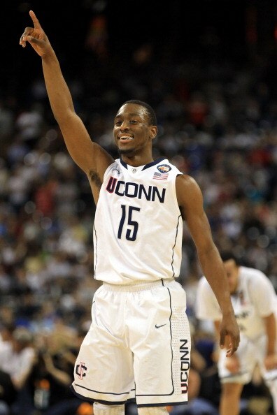 HOUSTON, TX - APRIL 04:  Kemba Walker #15 of the Connecticut Huskies celebrates towards the end of the game against the Butler Bulldogs to win the National Championship Game of the 2011 NCAA Division I Men's Basketball Tournament at Reliant Stadium on Apr