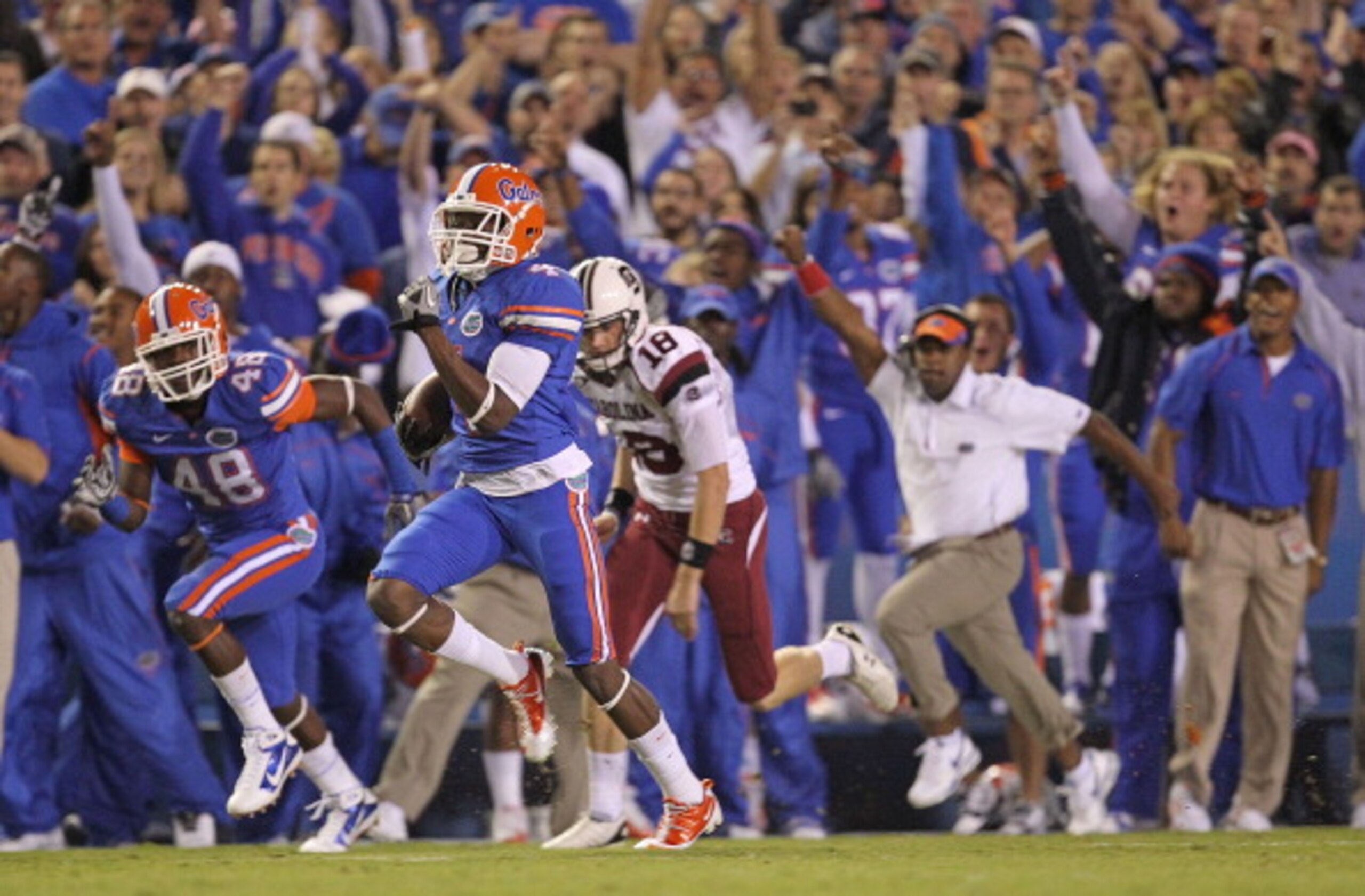 GAINESVILLE, FL - NOVEMBER 13: Andre Debose #4 of the Florida Gators returns the opening kickoff for a touchdown during a game against the South Carolina Gamecocks at Ben Hill Griffin Stadium on November 13, 2010 in Gainesville, Florida. (Photo by Mike GAINESVILLE, FL - NOVEMBER 13: Andre Debose #4 of the Florida Gators returns the opening kickoff for a touchdown during a game against the South Carolina Gamecocks at Ben Hill Griffin Stadium on November 13, 2010 in Gainesville, Florida. (Photo by Mike