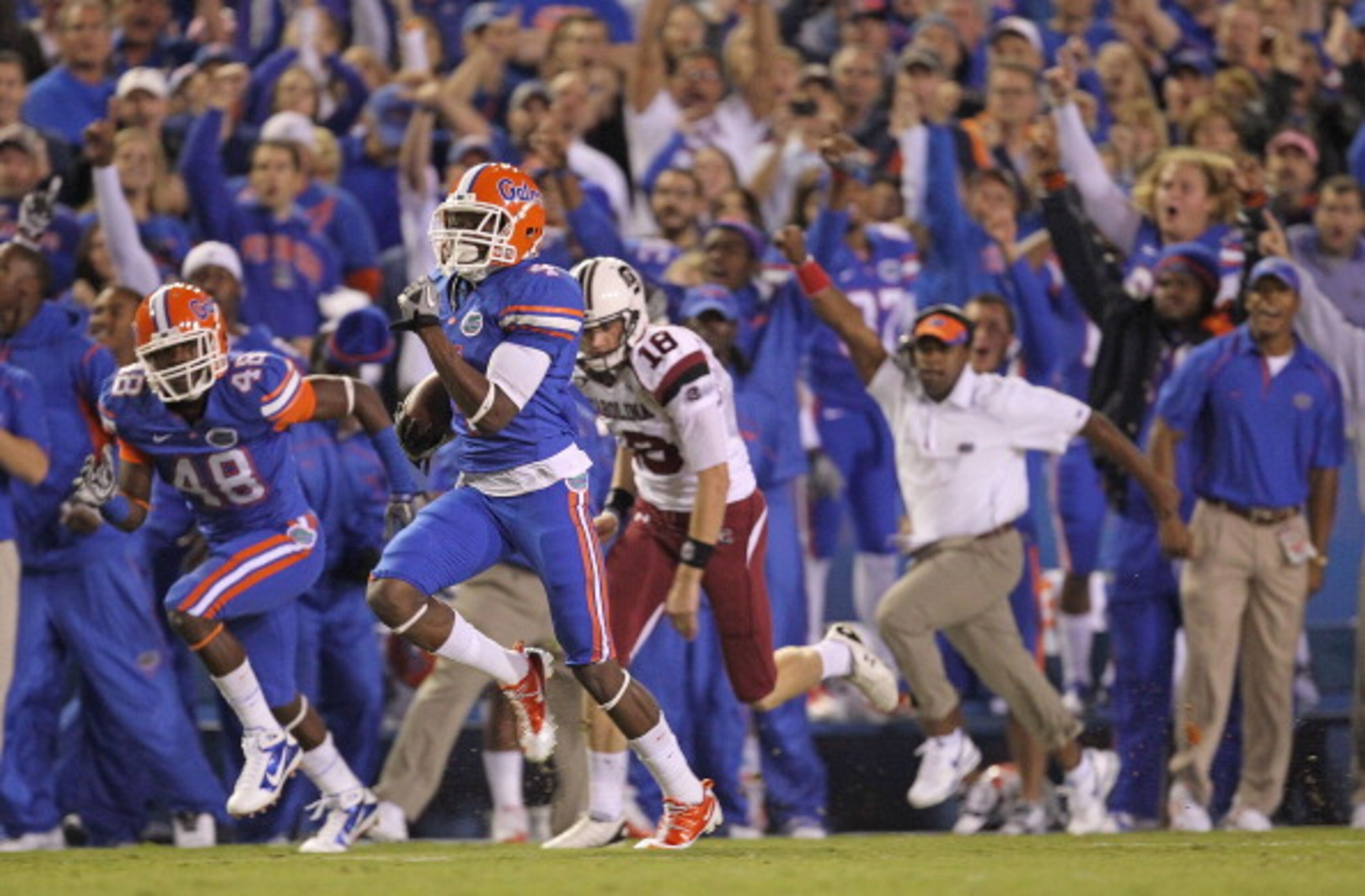 GAINESVILLE, FL - NOVEMBER 13:  Andre Debose #4 of the Florida Gators returns the opening kickoff for a touchdown during a game against the South Carolina Gamecocks at Ben Hill Griffin Stadium on November 13, 2010 in Gainesville, Florida.  (Photo by Mike