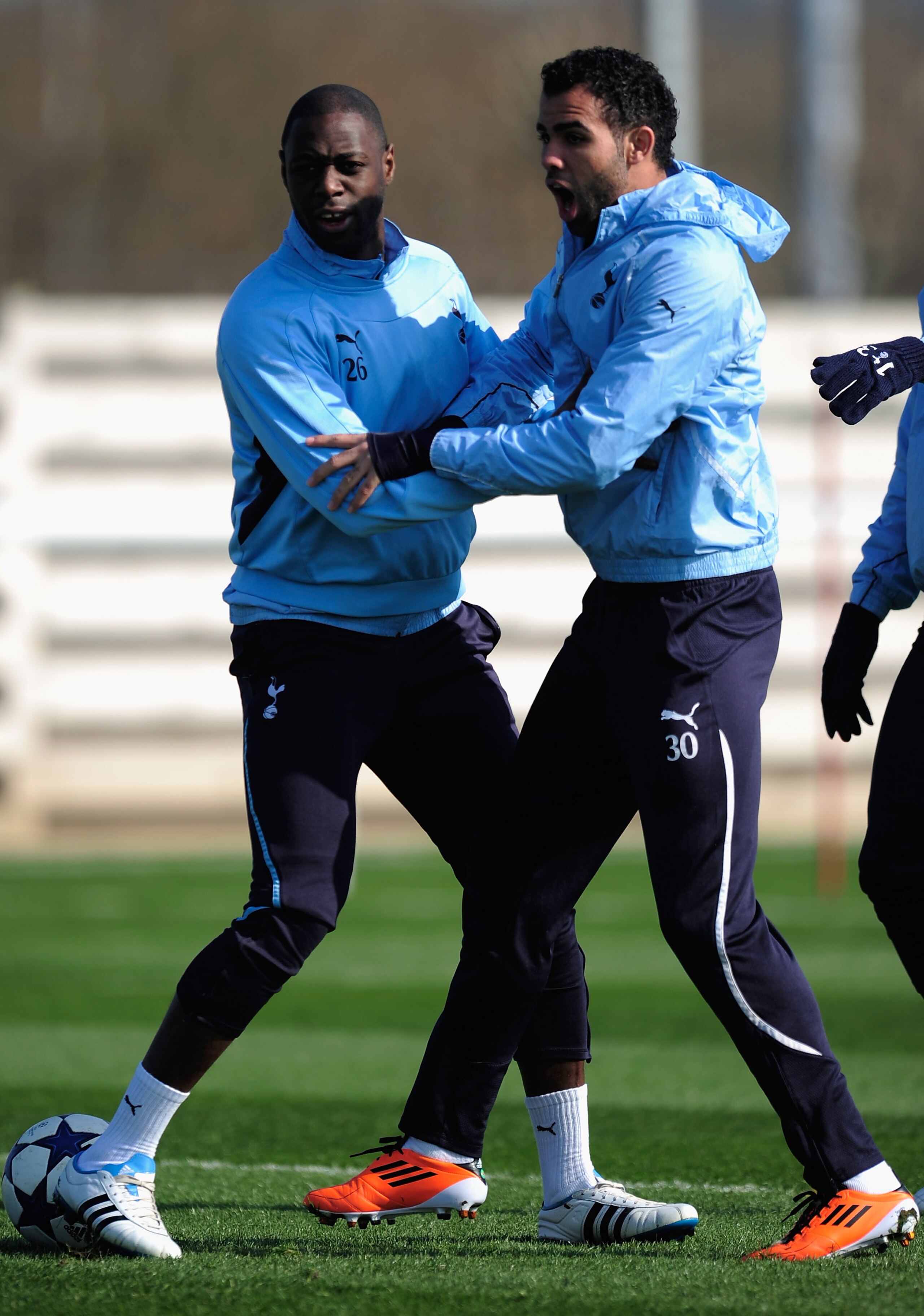 LONDON, ENGLAND - MARCH 08:  Ledley King and Sandro of Tottenham Hotspur warm up at a Tottenham Hotspur training session at the Spurs Lodge on March 8, 2011 in London, England.  (Photo by Jamie McDonald/Getty Images)