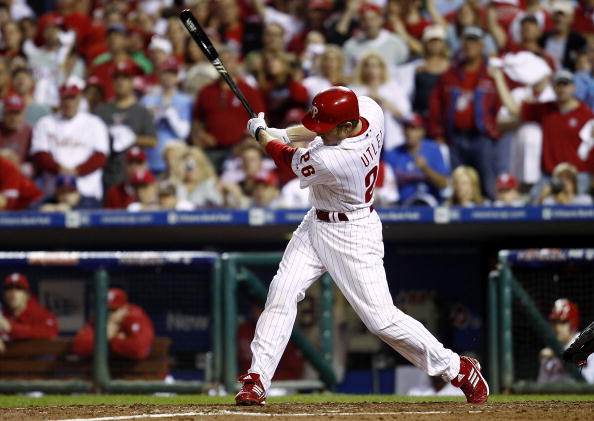 PHILADELPHIA - OCTOBER 08:  Chase Utley #26 of the Philadelphia Phillies hits a 2-RBI single in the fifth inning against the Cincinnati Reds in Game 2 of the NLDS at Citizens Bank Park on October 8, 2010 in Philadelphia, Pennsylvania.  (Photo by Jeff Zele