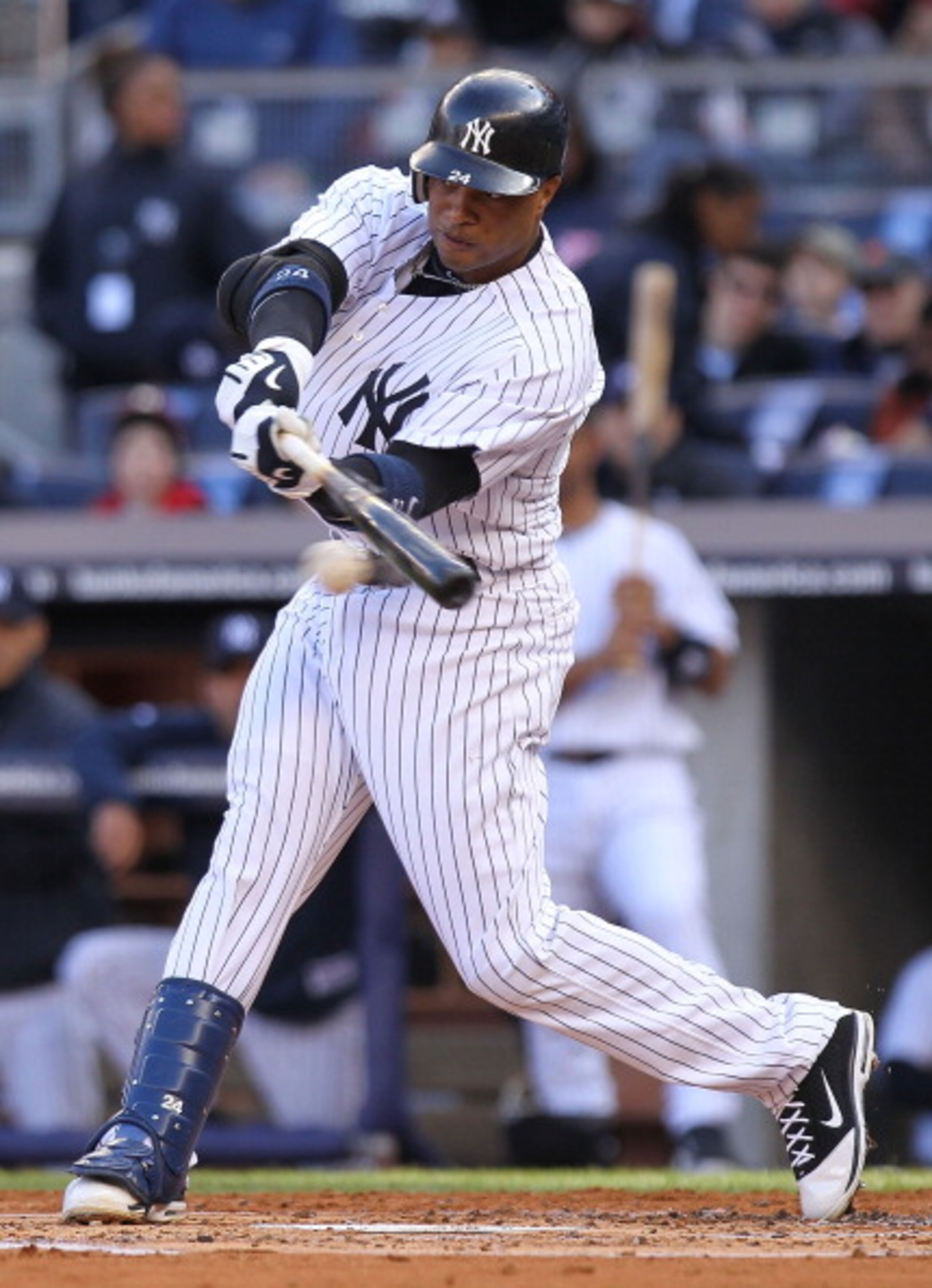 NEW YORK, NY - APRIL 02: Robinson Cano #24 of the New York Yankees hits an RBI single against the Detroit Tigers at Yankee Stadium on April 2, 2011 in the Bronx borough of New York City.  (Photo by Nick Laham/Getty Images)