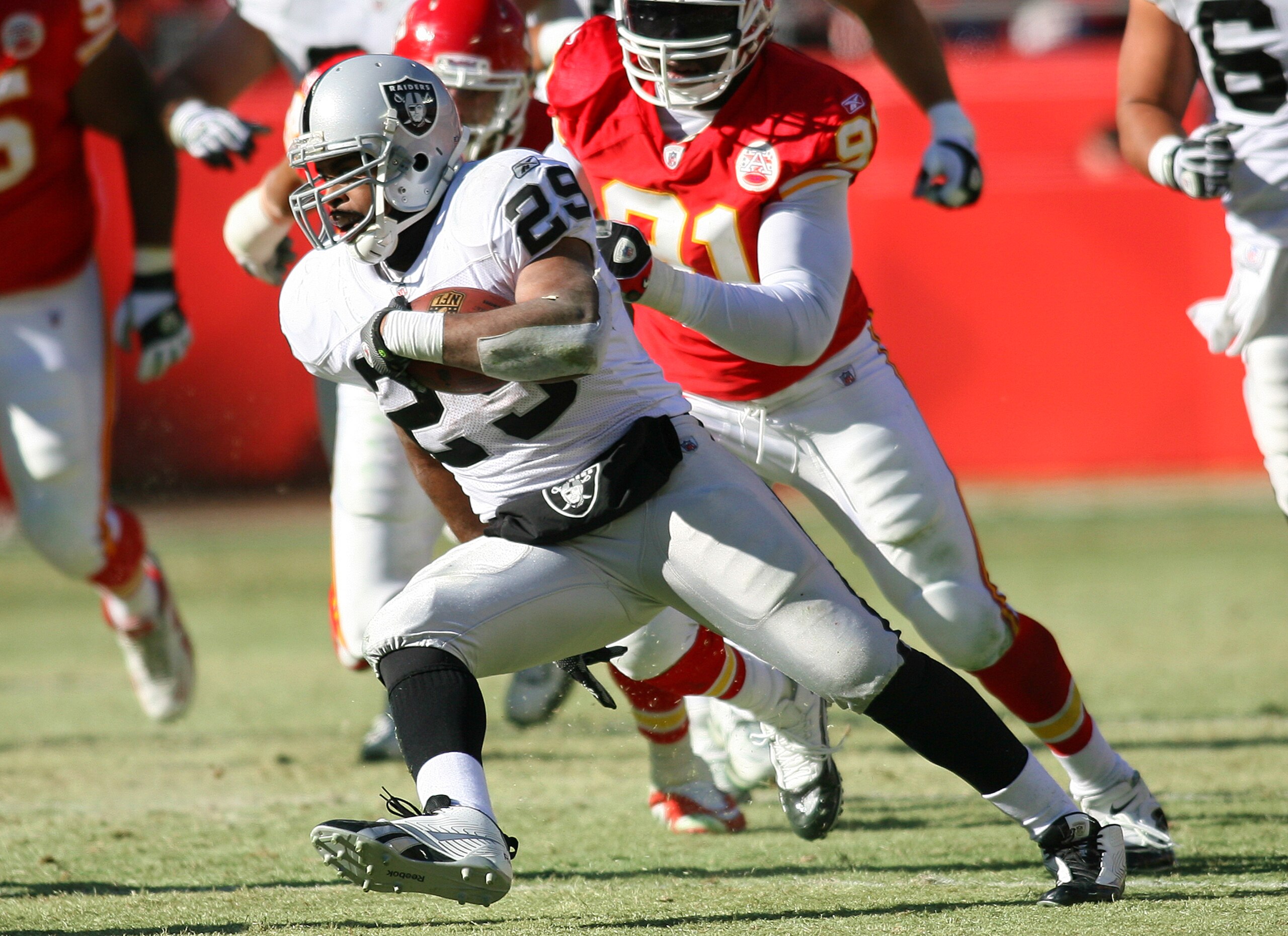 KANSAS CITY, MO - JANUARY 02:  Running back Michael Bush #29 of the Oakland Raiders runs down field in a game against the Kansas City Chiefs at Arrowhead Stadium on January 2, 2011 in Kansas City, Missouri.  (Photo by Tim Umphrey/Getty Images)