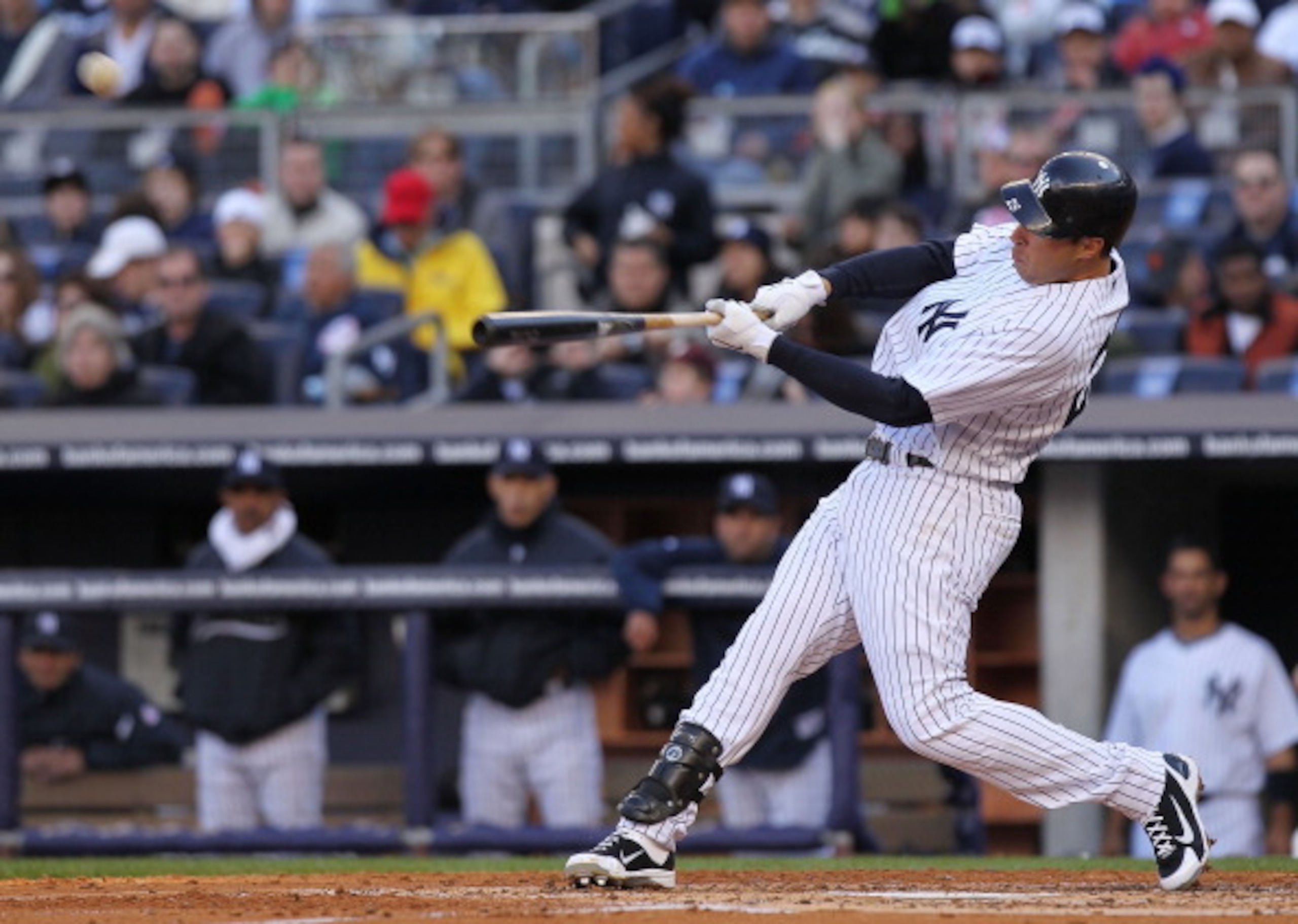 NEW YORK, NY - APRIL 02:  Mark Teixeira #25 of the New York Yankees hits 3 RBI home run against the Detroit Tigers at Yankee Stadium on April 2, 2011 in the Bronx borough of New York City.  (Photo by Nick Laham/Getty Images)