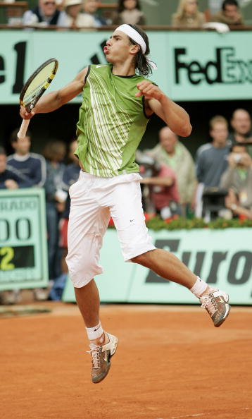 PARIS - JUNE 05:  Rafael Nadal of Spain celebrates a point during the Mens Final match against Mariano Puerta of Argentina on the fourteenth day of the French Open at Roland Garros on June 5, 2005 in Paris, France.  (Photo by Clive Mason/Getty Images)