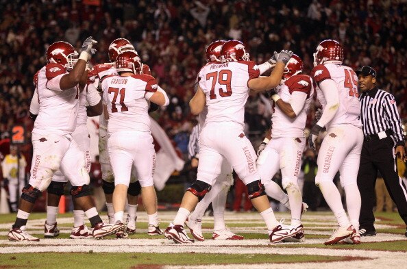 COLUMBIA, SC - NOVEMBER 06:  Knile Davis #7 of the Arkansas Razorbacks is congratulated by teammates after scoring a touchdown against the South Carolina Gamecocks during their game at Williams-Brice Stadium on November 6, 2010 in Columbia, South Carolina