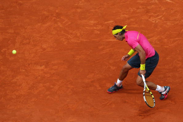 PARIS - MAY 31:  A dejected Rafael Nadal of Spain misses a shot as he heads towards defeat during the Men's Singles Fourth Round match against Robin Soderling of Sweden on day eight of the French Open at Roland Garros on May 31, 2009 in Paris, France.  (P