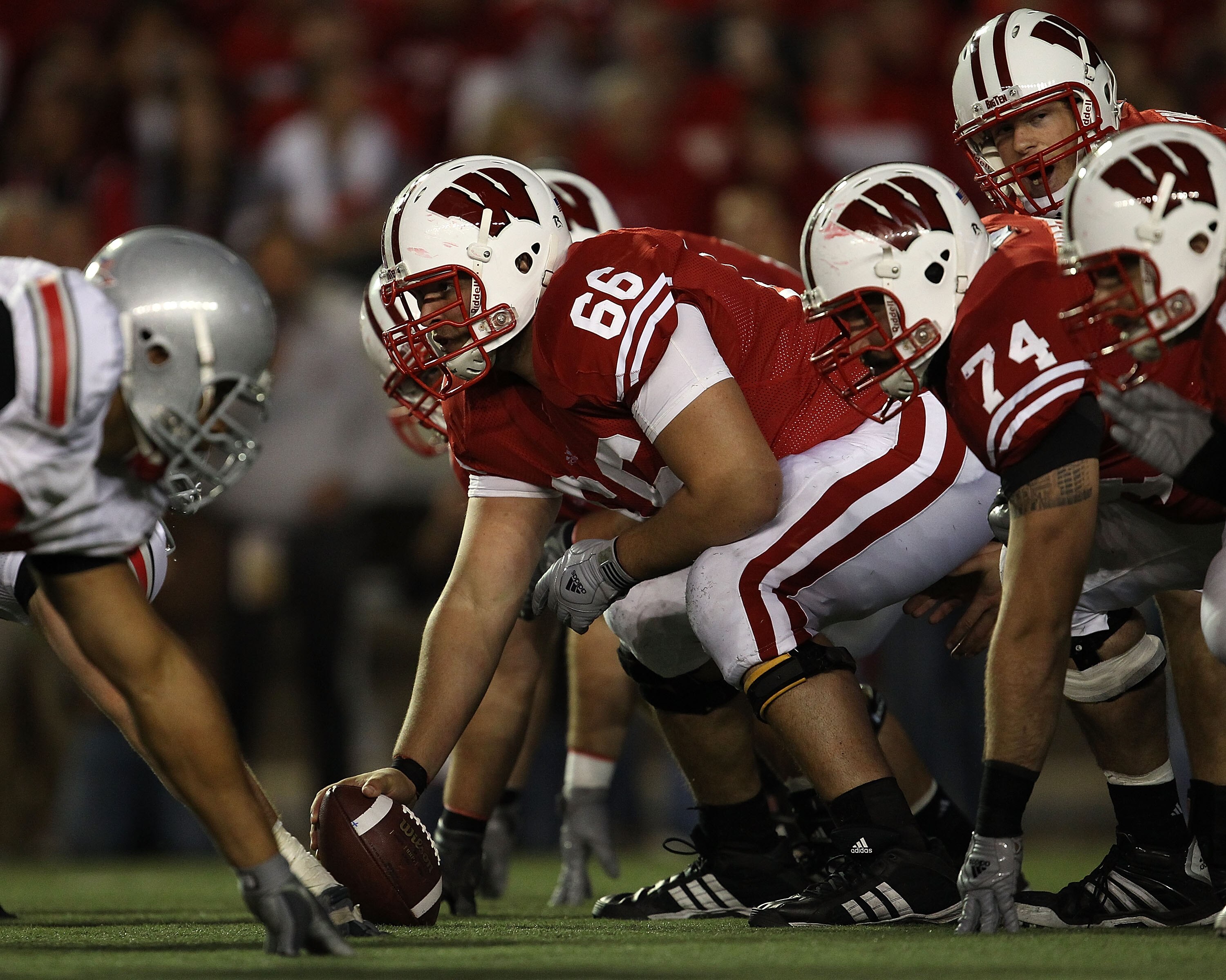 MADISON, WI - OCTOBER 16: Peter Konz #66 of the Wisconsin Badgers prepares to snap the ball to Scott Tolzien #16 against the Ohio State Buckeyes at Camp Randall Stadium on October 16, 2010 in Madison, Wisconsin. Wisconsin defeated Ohio State 31-18.  (Phot