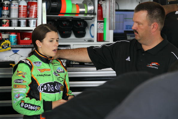 JOLIET, IL - JULY 09:  Danica Patrick, driver of the GoDaddy.com Chervrolt, talks with crew chief Tony Eury Jr. in the garage during practice for the NASCAR Nationwide Series Dollar General 300 Powered by Coca-Cola at the Chicagoland Speedway on July 9, 2