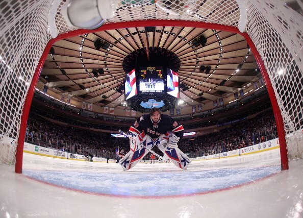 NEW YORK, NY - APRIL 04: Henrik Lundqvist #30 of the New York Rangers gets set for the opening faceoff against the Boston Bruins at Madison Square Garden on April 4, 2011 in New York City. The Rangers defeated the Bruins 5-3. (Photo by Bruce Bennett/Getty