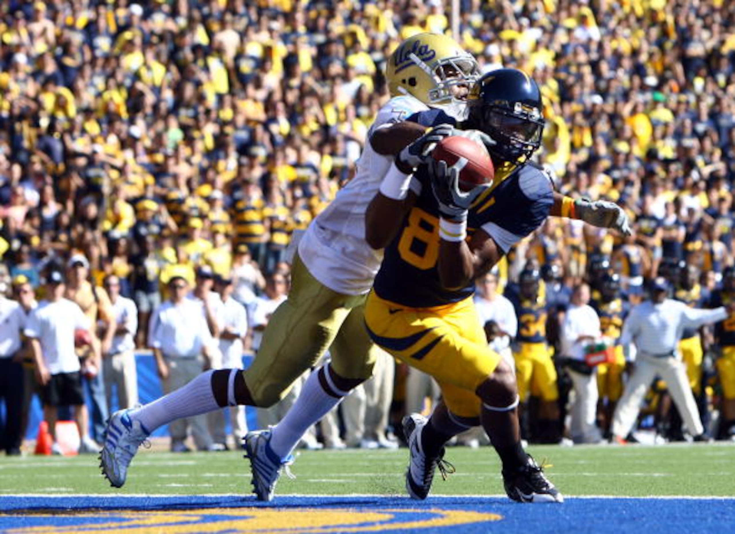 BERKELEY, CA - OCTOBER 25:  Wide receiver LaReylle Cunningham #85 of the Cal Golden Bears appears to a make a catch but would later drop it while being defended by by Rahim Moore #3 of the UCLA Bruins during the first quarter at Memorial Stadium on Octobe