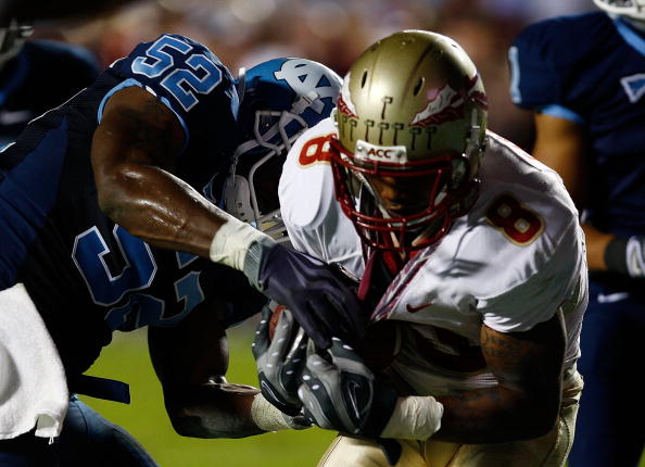 CHAPEL HILL, NC - OCTOBER 22:  Taiwan Easterling #8 of the Florida State Seminoles scores a second half touchdown in front of North Carolina Tar Heels defender Quan Sturdivant #52 at Kenan Stadium on October 22, 2009 in Chapel Hill, North Carolina.  (Phot